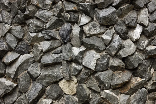 Камни, установленные в стене из бетона 2 — стоковое фото