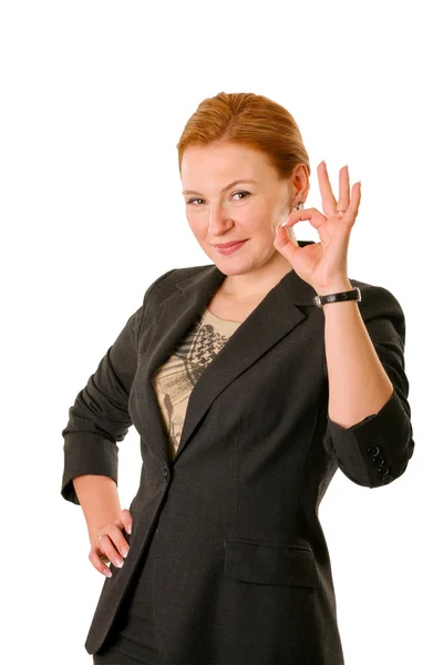 Женщина в костюме с жестом ОК — стоковое фото