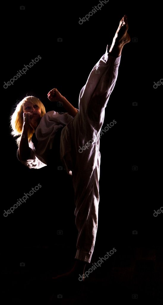 Girl in kimono make kick — Stock Photo © svyatoslavlipik #1274027