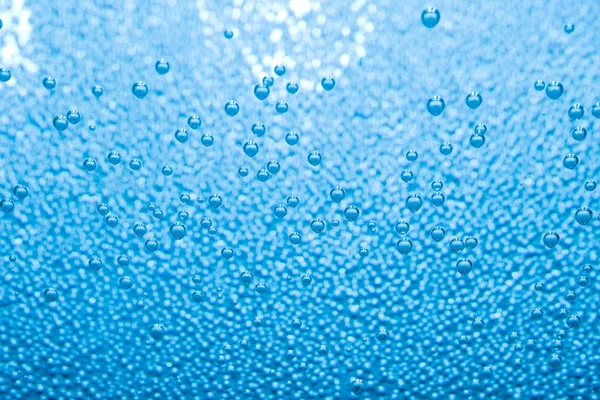 stock image Macro of blue air bubbles in water