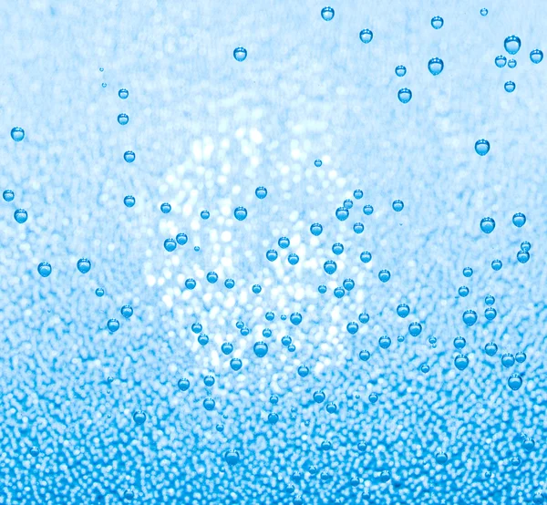 Macro of blue air bubbles in water — Stock Photo, Image