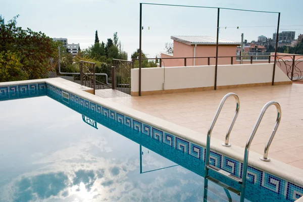Swimming pool with ledder — Stock Photo, Image
