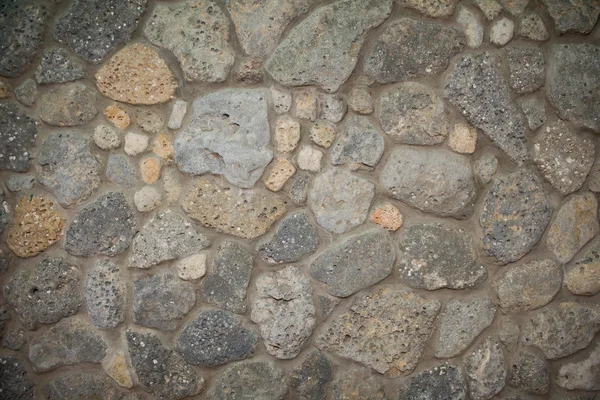 Gris granit pierres montées dans le mur — Photo