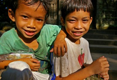 Cambodian children, selling postcards clipart