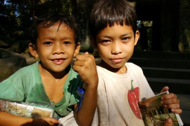 Cambodian kids, selling postcards clipart
