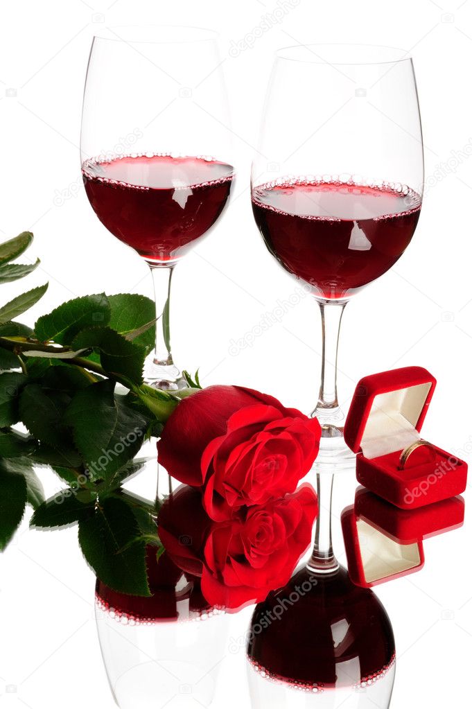 Red wine, rose and wedding rings