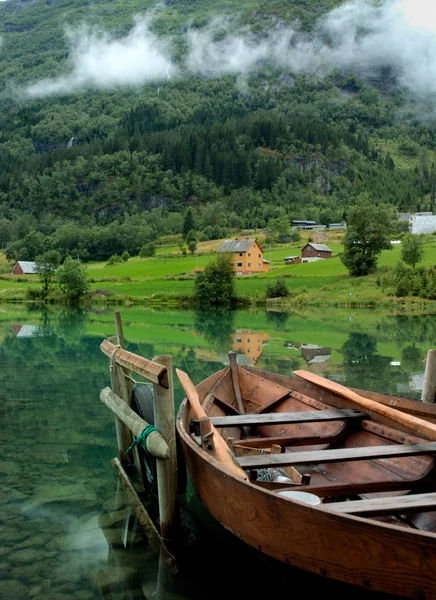 Wooden boat on fjord — Stock Photo, Image