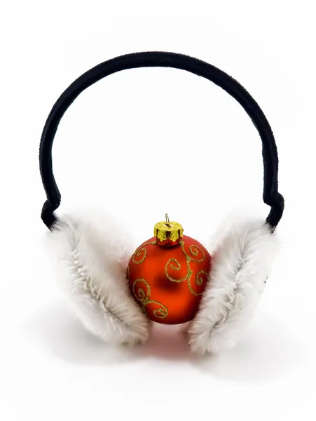 Christmas ball with headphones on white — Stock Photo, Image