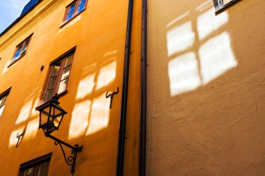 Window reflections on old town walls clipart