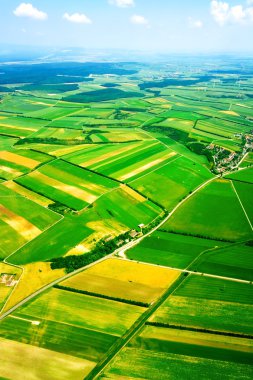 Aerial view of rural landscape under sky clipart