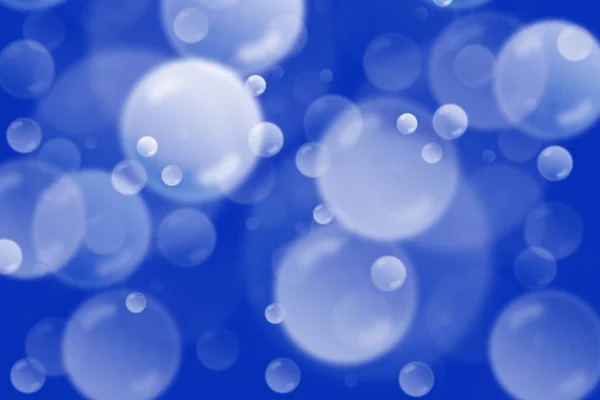 Blue background with flying bubbles — Stock Photo, Image