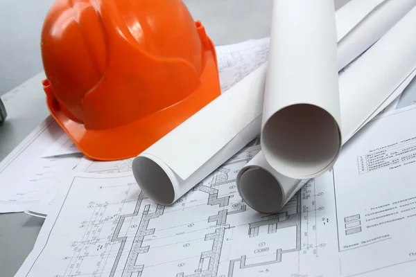 Building projects with architect drawing and protective tools — Stock Photo, Image
