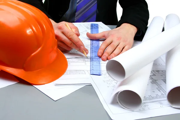 Architect working with technical drawing Royalty Free Stock Photos