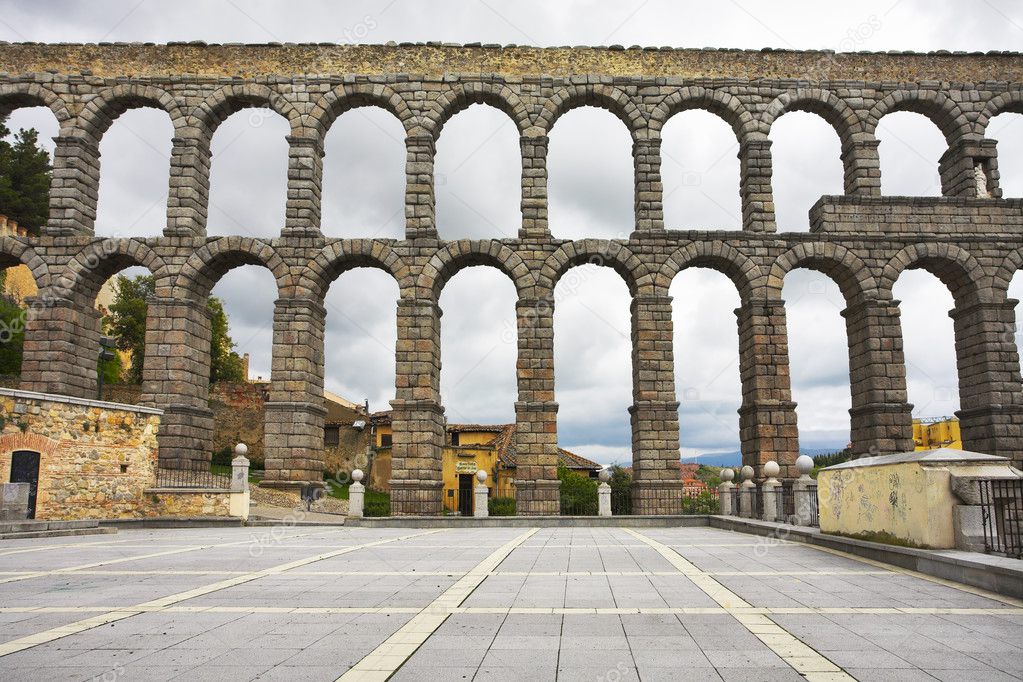 Antique aqueduct in cloudy day