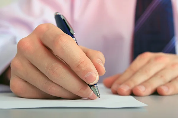 Hand with a pen. — Stock Photo, Image