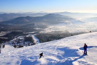 Mountain-skiers on the top of mountain. clipart