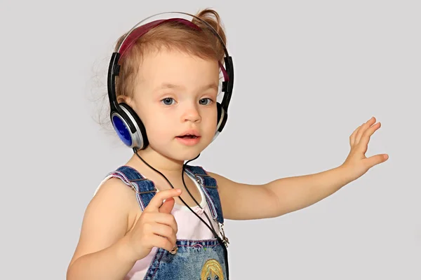 Girl with headsets. — Stock Photo, Image