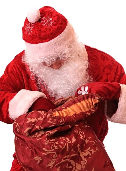 Weihnachtsmann mit einem Sack voller Geschenke. — Stockfoto