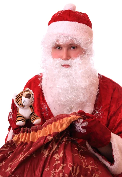Weihnachtsmann mit einem Sack voller Geschenke — Stockfoto