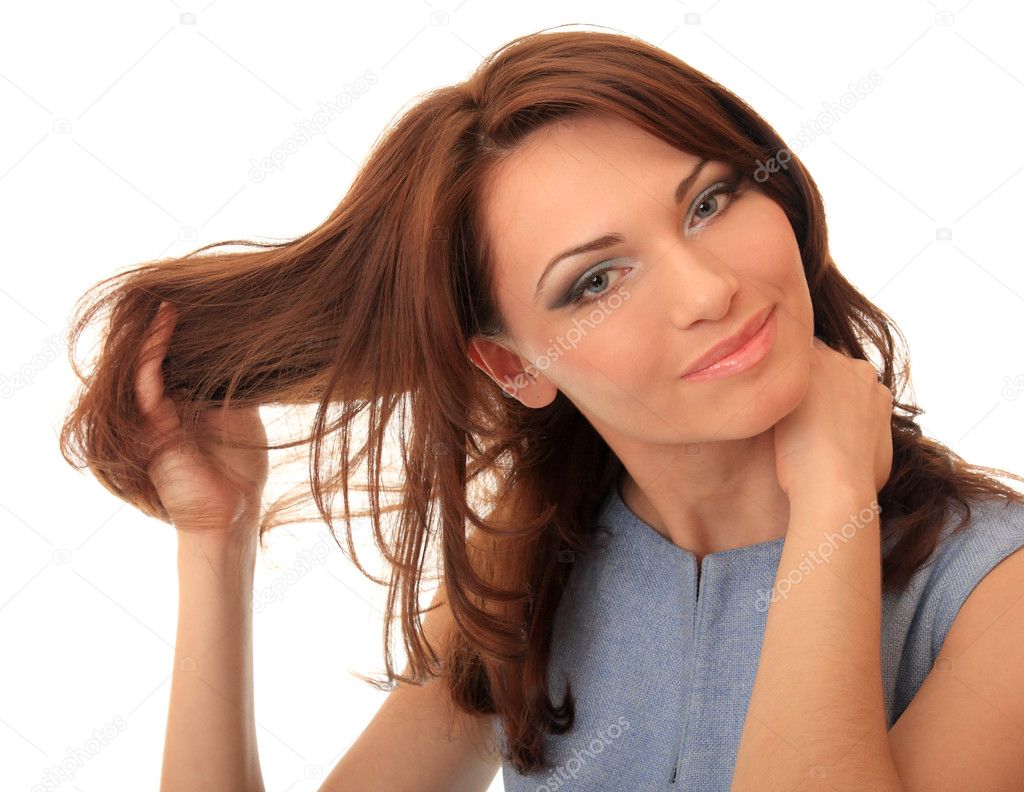 Beautiful girl straightens her hair