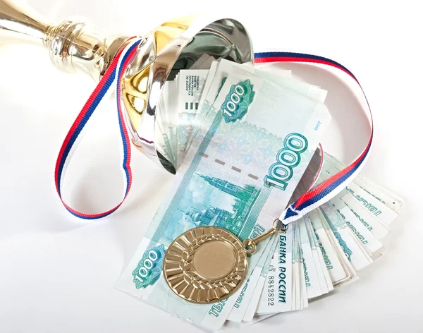 Cup, gold medal and Russian money. — Stock Photo, Image