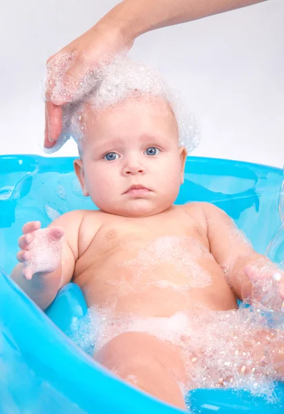 Kid in foam — Stock Photo, Image