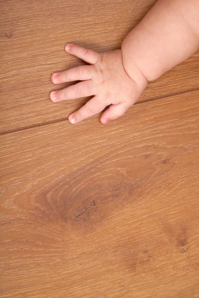 Child on wooden to a floor — Stock Photo, Image