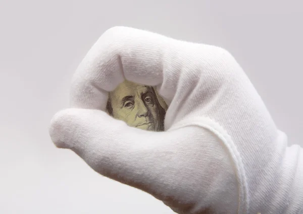 Доллар и рука — стоковое фото