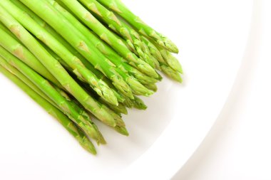 Asparagus on white plate clipart