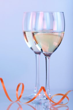 Two wine glasses with white wine clipart