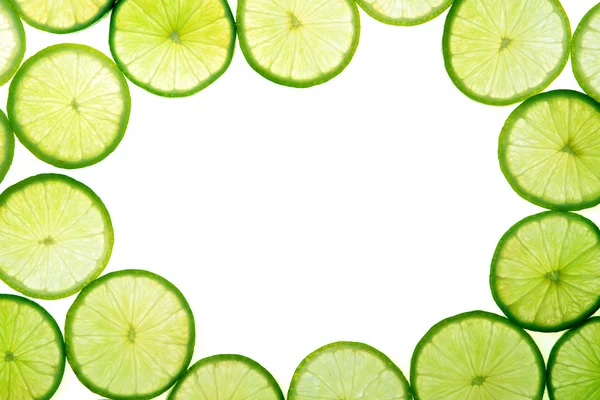 Fatias de limão verde fundo — Fotografia de Stock