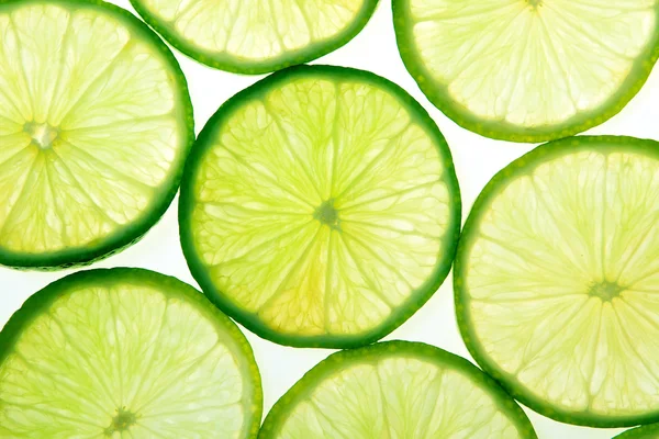 Grön lime skivor bakgrund — Stockfoto