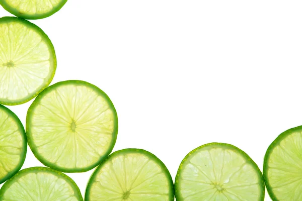 Green lime slices background — Stock Photo, Image
