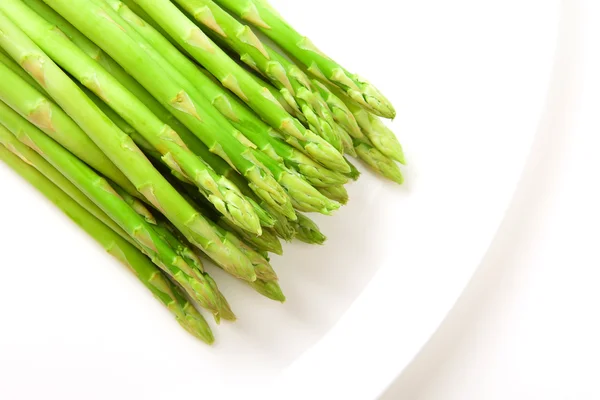 Asparagus on white plate — Stock Photo, Image