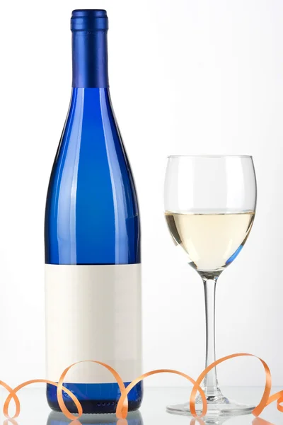 Blue bottle of white wine and wine glass — Stock Photo, Image