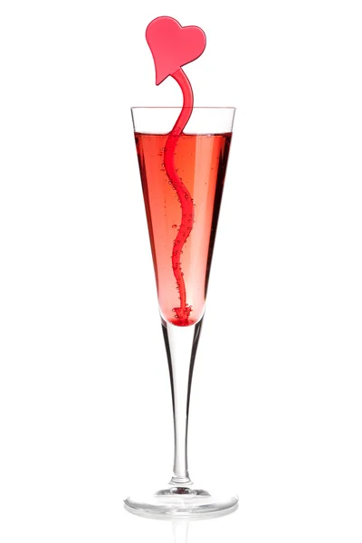 Red champagne cocktail with heart decor — Stock Photo, Image