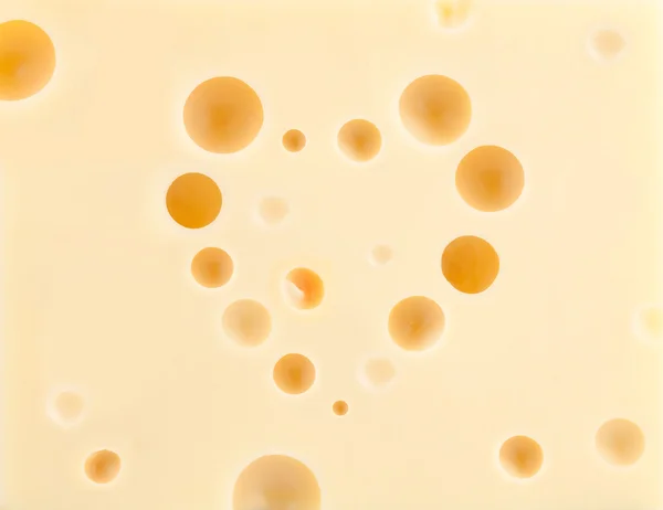 Τυρί φόντο με καρδιά σχήμα τρύπες — Φωτογραφία Αρχείου