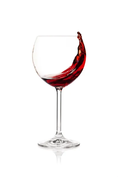 Rozpryskiwania czerwonego wina w szklance — Zdjęcie stockowe
