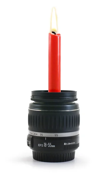 Lens with a candle — Stock Photo, Image