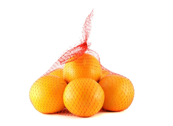 Orangen im Netzbeutel — Stockfoto