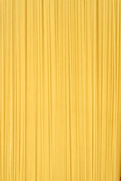 Esparguete italiano não cozido fundo — Fotografia de Stock