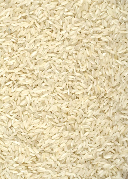 Неприготовленный белый рисовый фон — стоковое фото