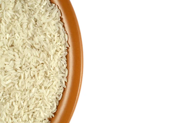 Üzerinde kahverengi bir seramik tabak pirinç — Stok fotoğraf