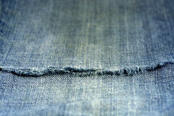Old ripped jeans background — Stock Photo, Image