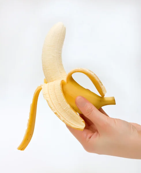 Банан и рука — стоковое фото