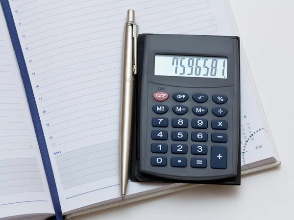 Pen, notebook, calculator — Stock Photo, Image