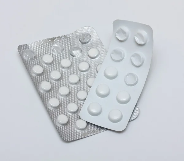 Две пачки таблеток. — стоковое фото
