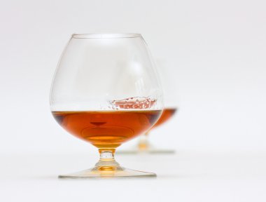 Two glasses of brandy clipart