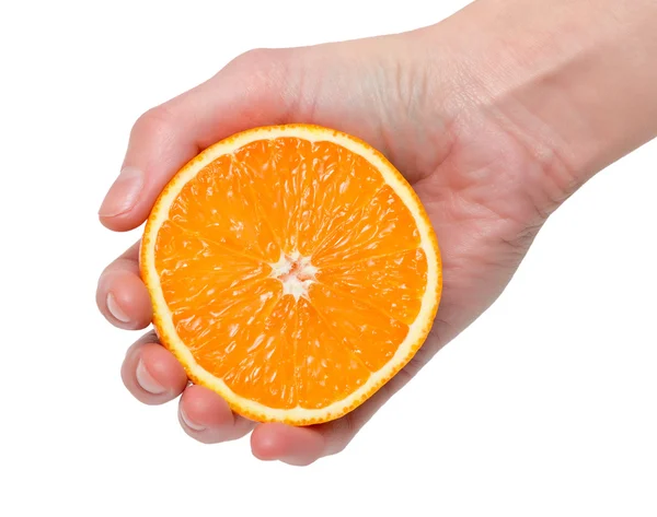 Hälften av orange i hand — Stockfoto