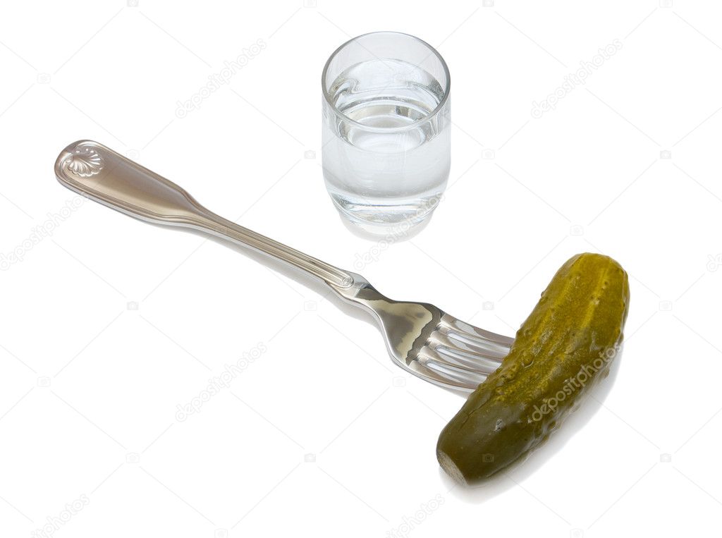 Glass of vodka and a cucumber
